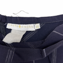Navy blue denim jeans with a 'cache cache' label on a white background